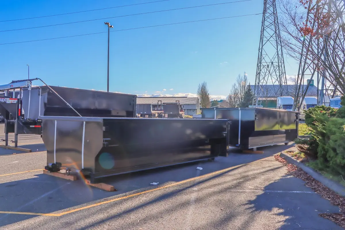 Roll-off dumpster ready for waste disposal at job site for Commercial Dumpster Rental in Spring Lake